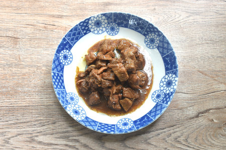 salty boiled slice dice pork meat in soy sauce on plateの写真素材