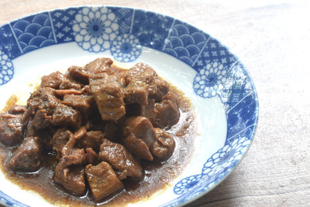 salty boiled slice dice pork meat in soy sauce on plateの写真素材