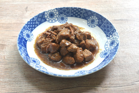 salty boiled slice dice pork meat in soy sauce on plateの写真素材