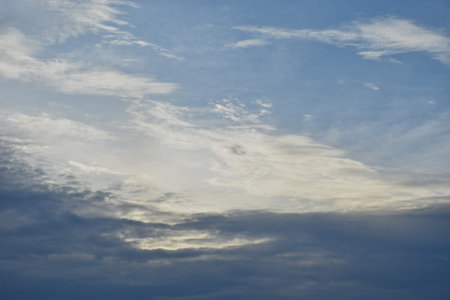 dark rain cloud floating on sky at sunset in eveningの写真素材
