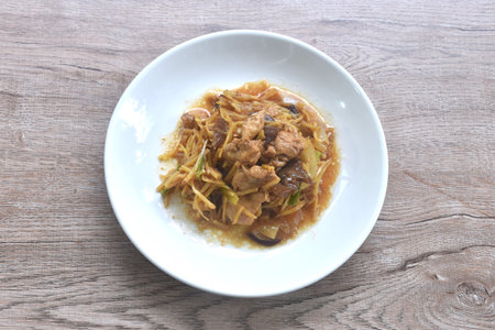 stir fried chicken with slice ginger and black ear mushroom on plateの写真素材
