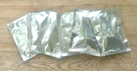 snack package aluminum foil mock-up arranging on tableの写真素材