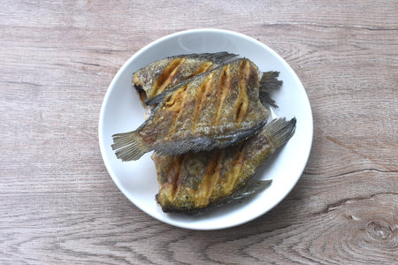 deep fried snake skin catfish or gourami arranging on dish