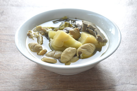 boiled pickled cabbage with pork innard in clear soup on bowlの写真素材