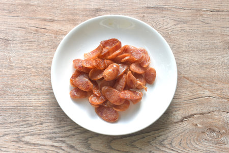 crispy fried slice Chinese pork sausage arranging on plateの写真素材