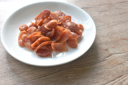 crispy fried slice Chinese pork sausage arranging on plateの写真素材