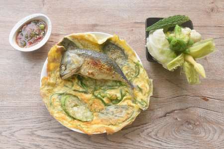 batter fried egg stuffed eggplant and mackerel with boiled vegetable on plate dipping spicy shrimp paste sauceの写真素材