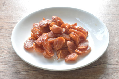 crispy fried slice Chinese pork sausage arranging on plateの写真素材
