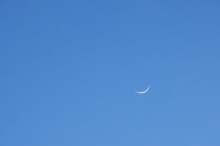 half moon floating on blue sky in twilight backgroundの写真素材