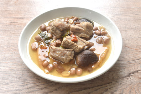 boiled chop pork bone with peanut and black mushroom soup on plateの写真素材