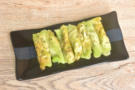 soft fresh coconut crepe topping black sesame Thai sweetmeat arranging on plateの写真素材