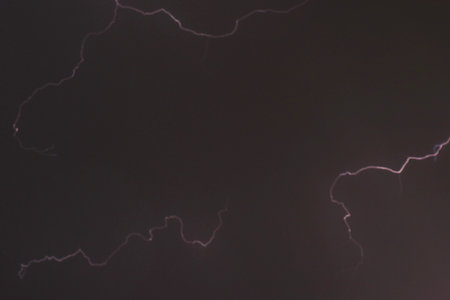 blurry lightning on cloud in dark sky at night white rain storm coming