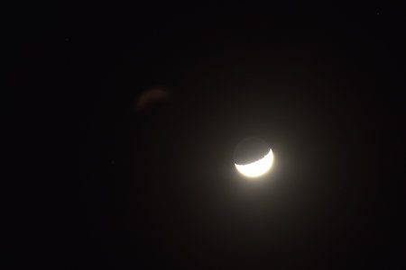 half moon shining floating on sky in night