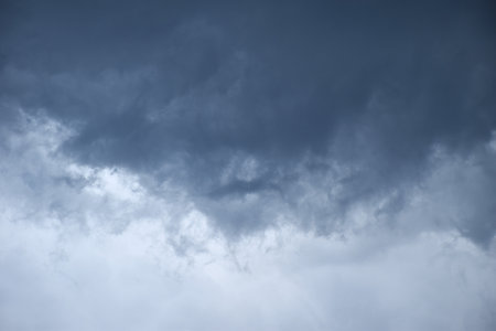 dark rain cloud floating on sky at sunset in eveningの写真素材