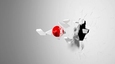 Red ball destroying a white wall.の写真素材