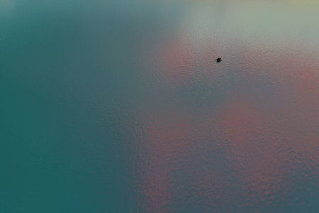 Lonely boat on a vast ocean.の写真素材