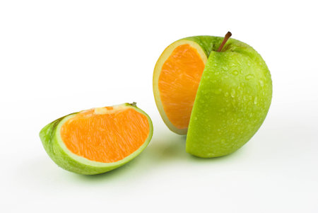 Sliced apple with moisture and an orange center.の写真素材