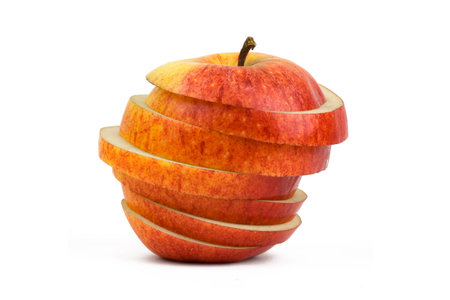 A red apple cutted with several piecesの写真素材