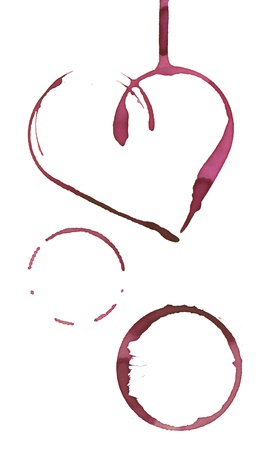 heart shape and circles made with stain from wine glassの写真素材