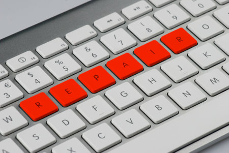  repair  written with red keys in a computer keyboardの写真素材