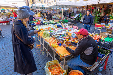 flower market in Rome on a sunny day in activity with sellers and customers in commercial transactionsの写真素材