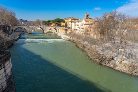 Two banks of the river Tiber with greenish waters with part of both banks of Rome. Italyの写真素材