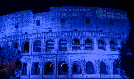 Rome coliseum facade with blue light projection to commemorate international epilepsy dayの写真素材