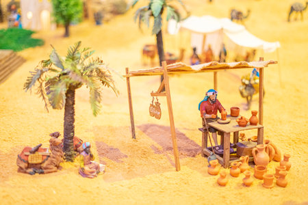 Model of human representation on a reduced scale measuring approximately 10cm. Profession of potter working with clay. Giant nativity scene in Vila Real de Santo Antonio.の写真素材