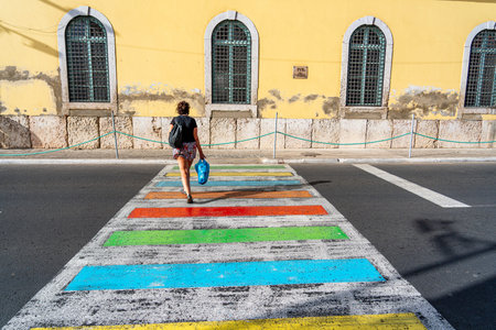 Woman walking on the colorful pedestrian crossing in Cartagena, Colombiaのeditorial素材