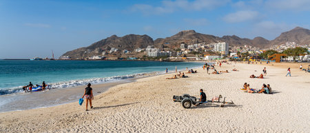 People on the beach in Faro, Portugal. Faro is the capital of the autonomous community of Madeira.