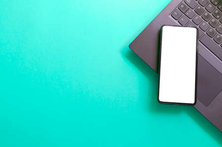 Computer, laptop, smartphone isolated screen on pink background workspaceの写真素材