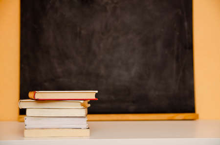 Board with colored crayons and a maskの写真素材