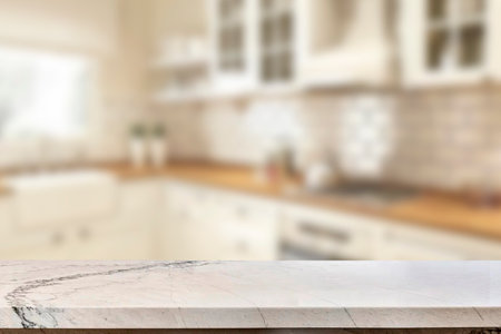 Empty marble top table with blurred kitchen interior Background. for product display.の写真素材