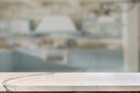 Empty marble top table with blurred kitchen interior Background. for product display.の写真素材