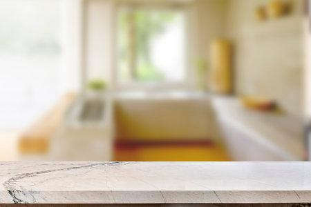 Empty marble top table with blurred kitchen interior Background. for product display.の写真素材
