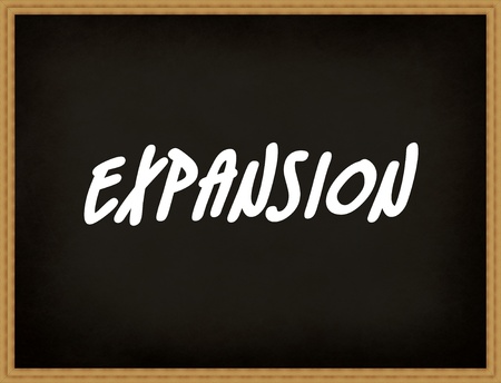 Expansion text on blackboardの写真素材