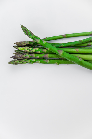 Green fresh asparagus isolated on whiteの写真素材