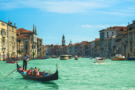 Venice, Italy - July 26 2011: Traditional Gondola with tourists at Grand Canal in Venice.のeditorial素材