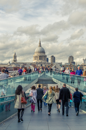 London, England - August 28 2014: City of London, Millennium bridge and St. Paul's cathedral in summer day.のeditorial素材
