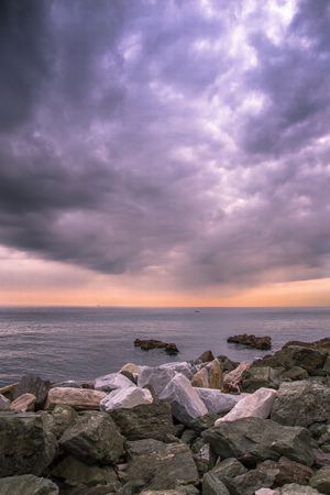 Beautiful sunset at the sea in Boccadasse  Genoa, Italy.