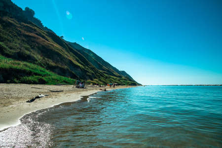 Fiorenzuola, Italy - July 06 2020: View of a wild beach on the Adriatic in the middle of summer in Fiorenzuola Italy.のeditorial素材