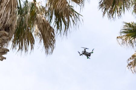 a drone flying and recording