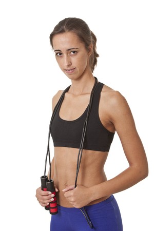 Sports Woman with jumping rope over her neck ready to work outの写真素材