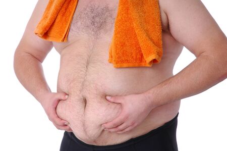 Fat man checking fat belly with towelの写真素材