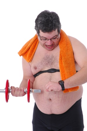 Fat man doing workout with dumbells, checking heart rate monitor, frightenedの写真素材