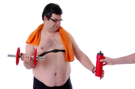Fat man doing workout with dumbells, receiving waterの写真素材