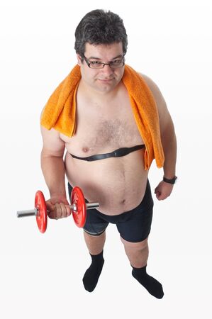 Fat man doing workout with dumbells, during trainingの写真素材
