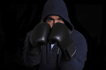 Fighter in training moment on black backgroundの写真素材