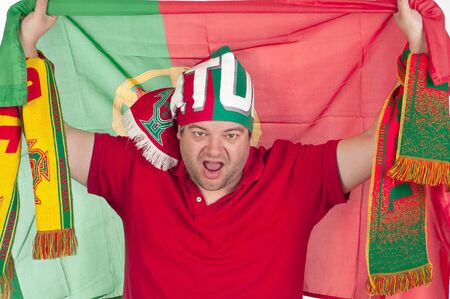 Portugal soccer fan with the portuguese flag on is backの写真素材