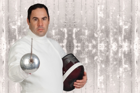 fencer athlete with sword and mask in actionの写真素材